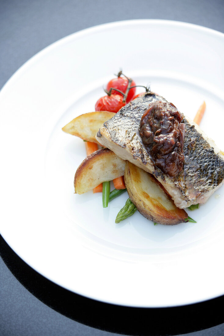 Sea bass with ginger chutney on plate at park Hyatt hotel, Moscow