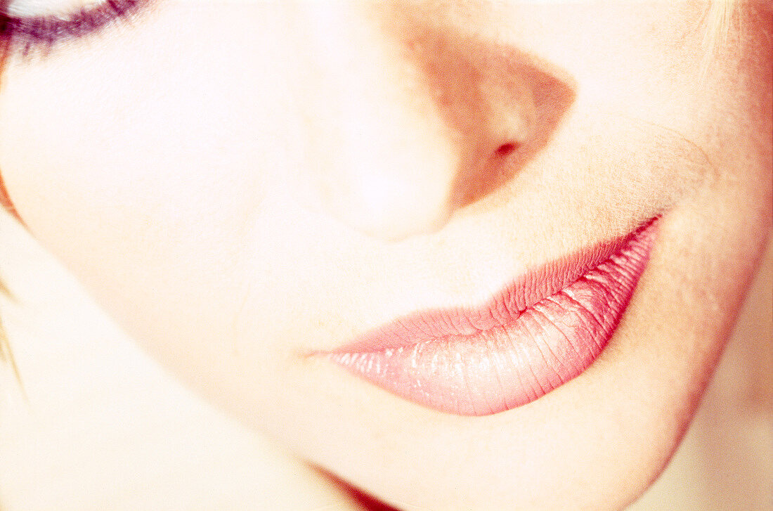 Close-up of woman wearing pink lipstick