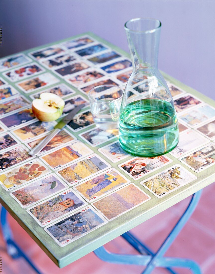 A folding table decorated with playing cards