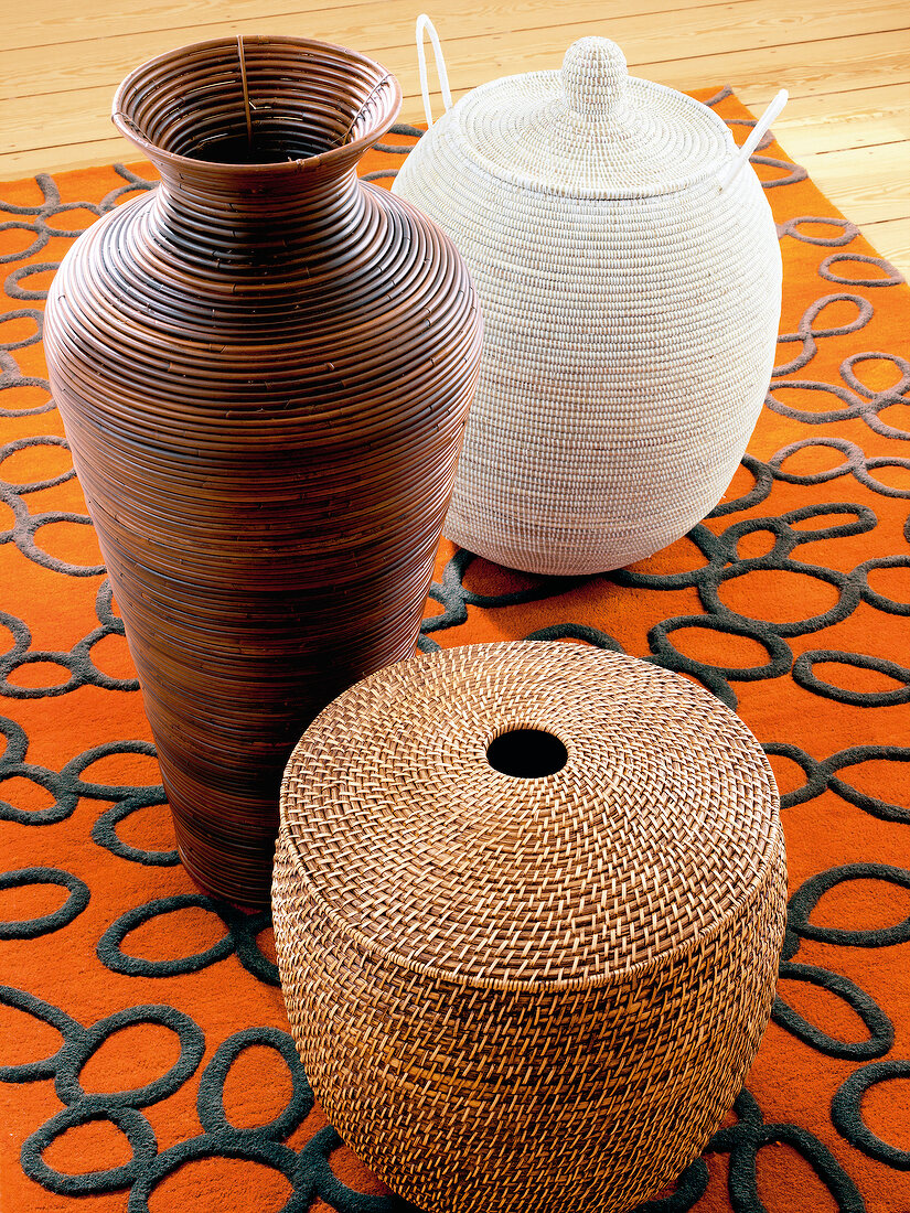 African styled woven and rattan baskets on carpet