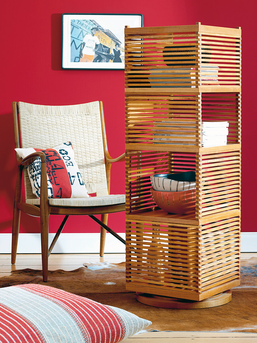 Revolving bookcase made of breu-wood with bins braid chair