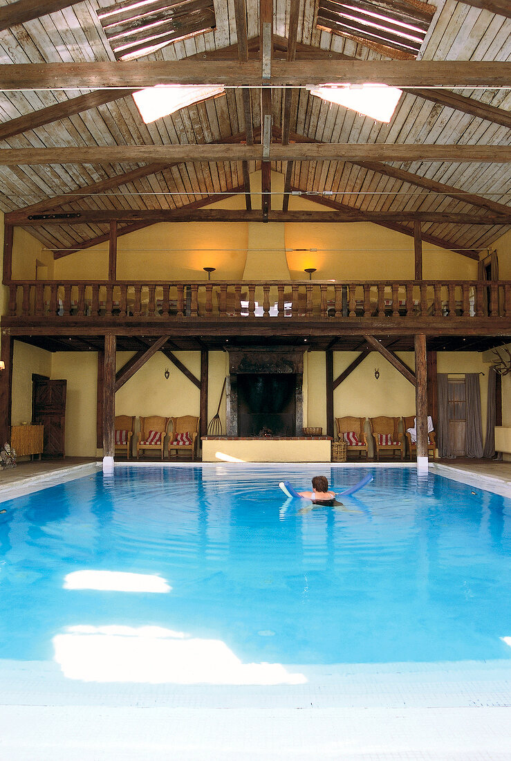 View of swimming pool and fire place with wooden roof in hotel zur bleiche