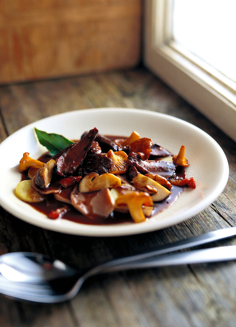 Rabbit stew with chestnut, noodles on plate