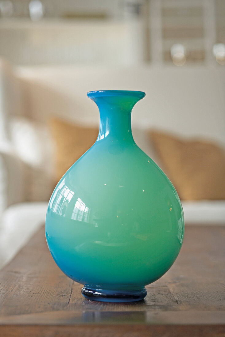 Close-up of turquoise glass vase