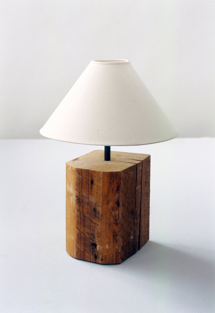 Lamp with old seasoned heartwood on white background