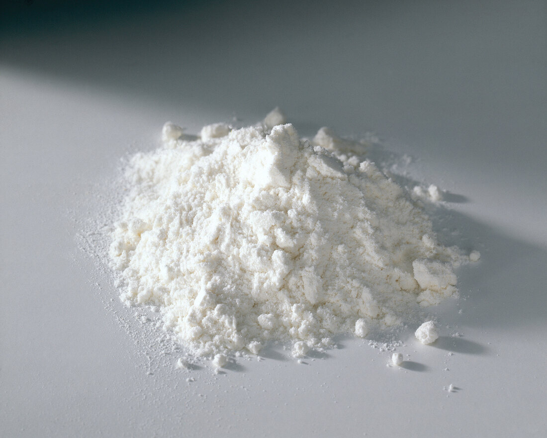 Heap of wheat flour on white background