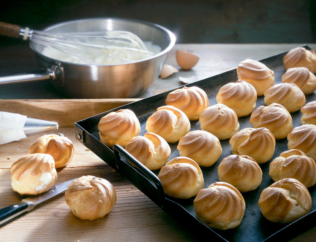 Vanilla cream puffs in baking tray