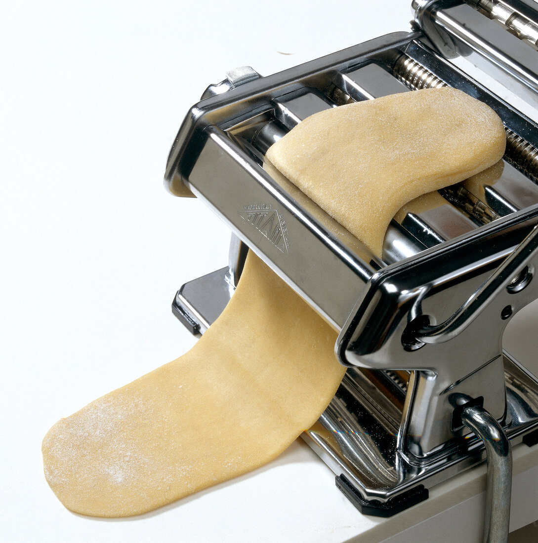 Close-up of pasta dough in cutting machine