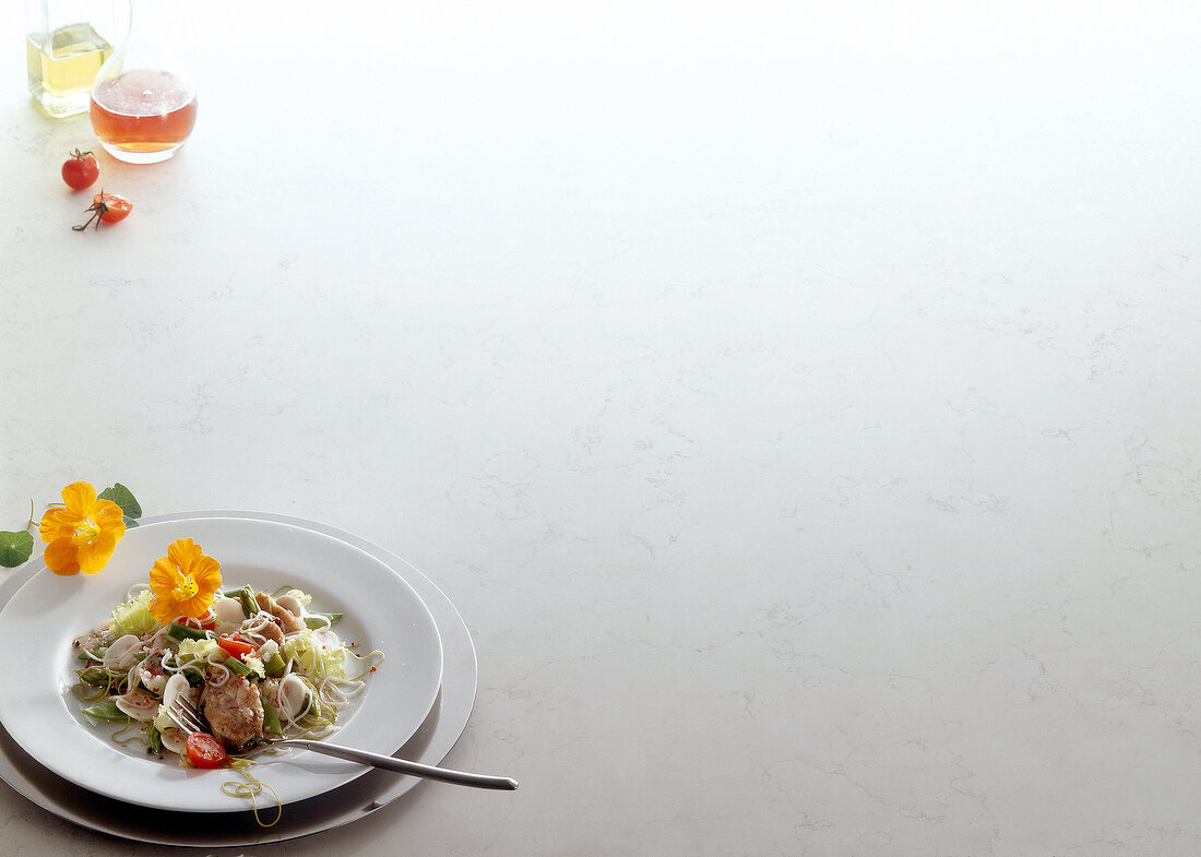 Sweetbreads with asparagus and noodles on plate, copy space