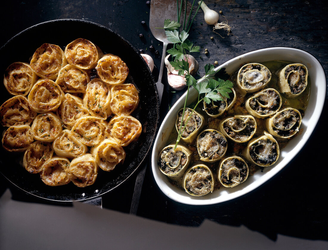 Herb donut and cannelloni stuffed with liver in serving dishes