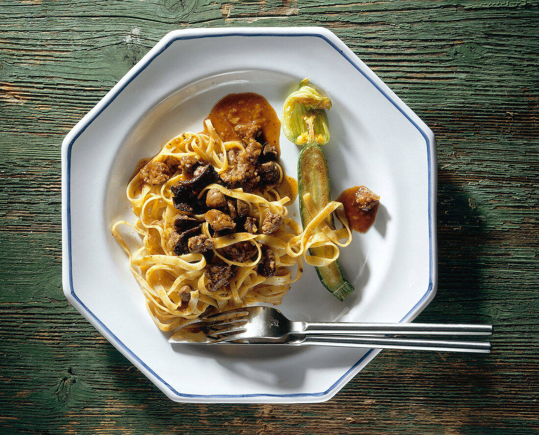 Taglierini with chicken liver on plate