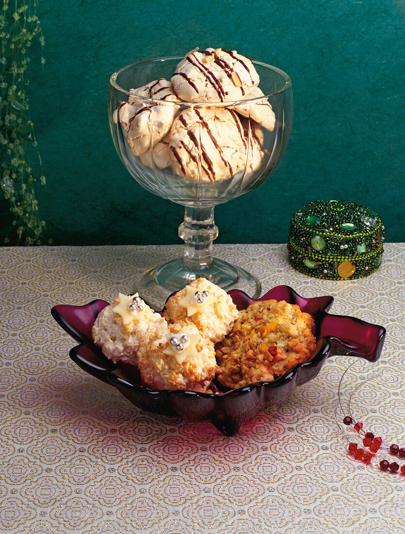 Coconut mountains, granola clusters and cookies in glass bowl