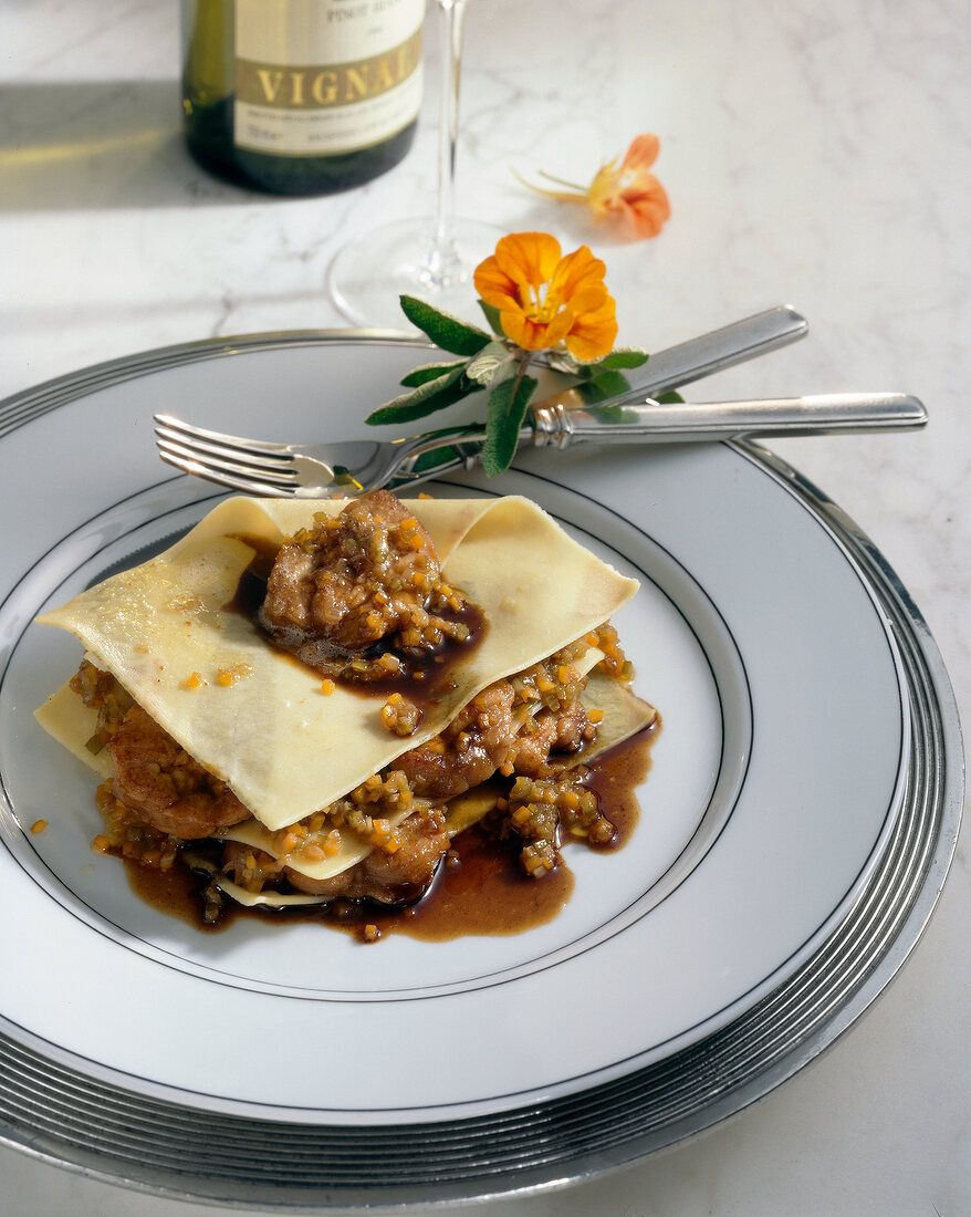 Close-up of sage pasta parcel filled with sweet bread on plate