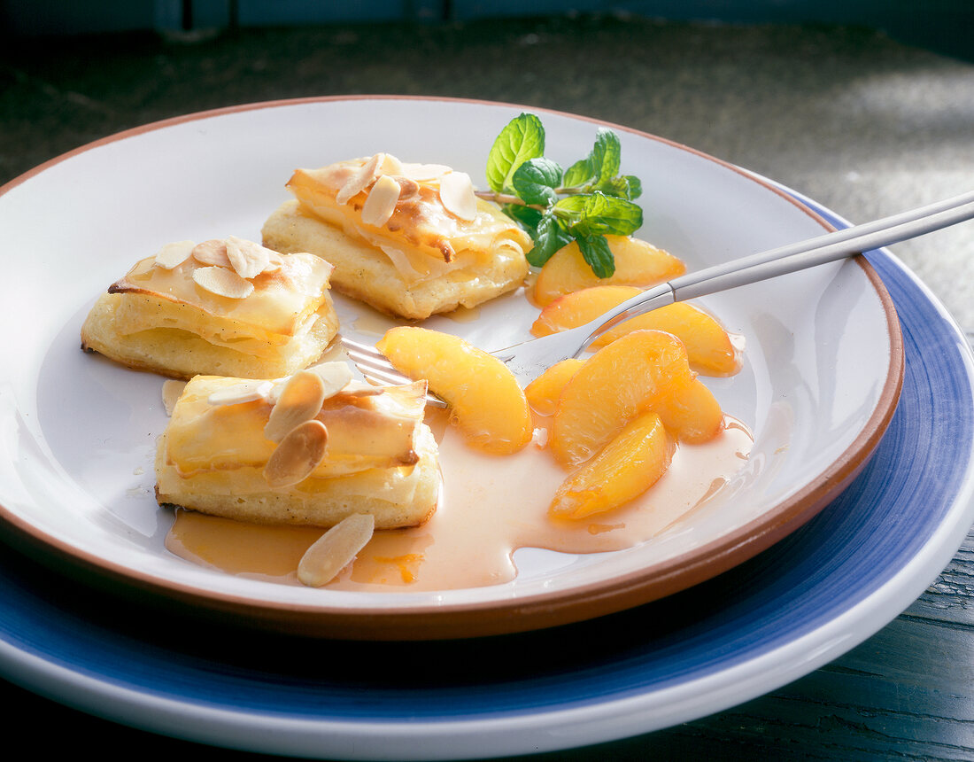 Slices of lemon semolina with compote on plate