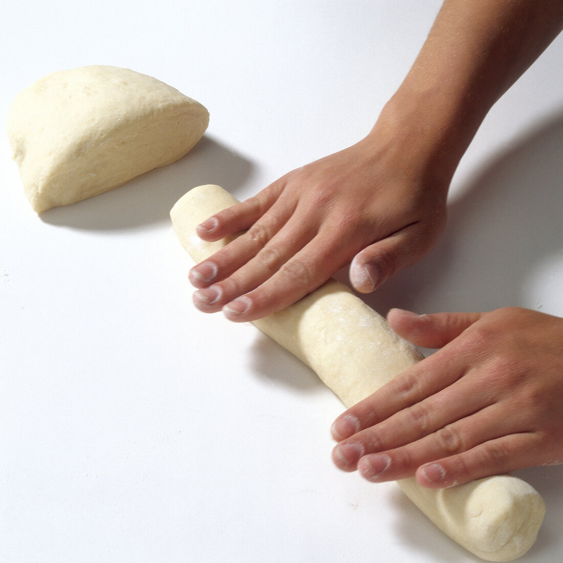 Rolls being made from dough while preparing pasta, step 8