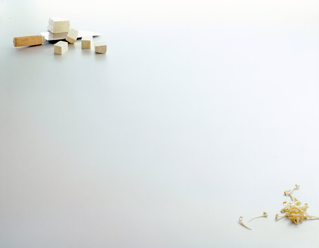 Tofu and sprouted beans on white background