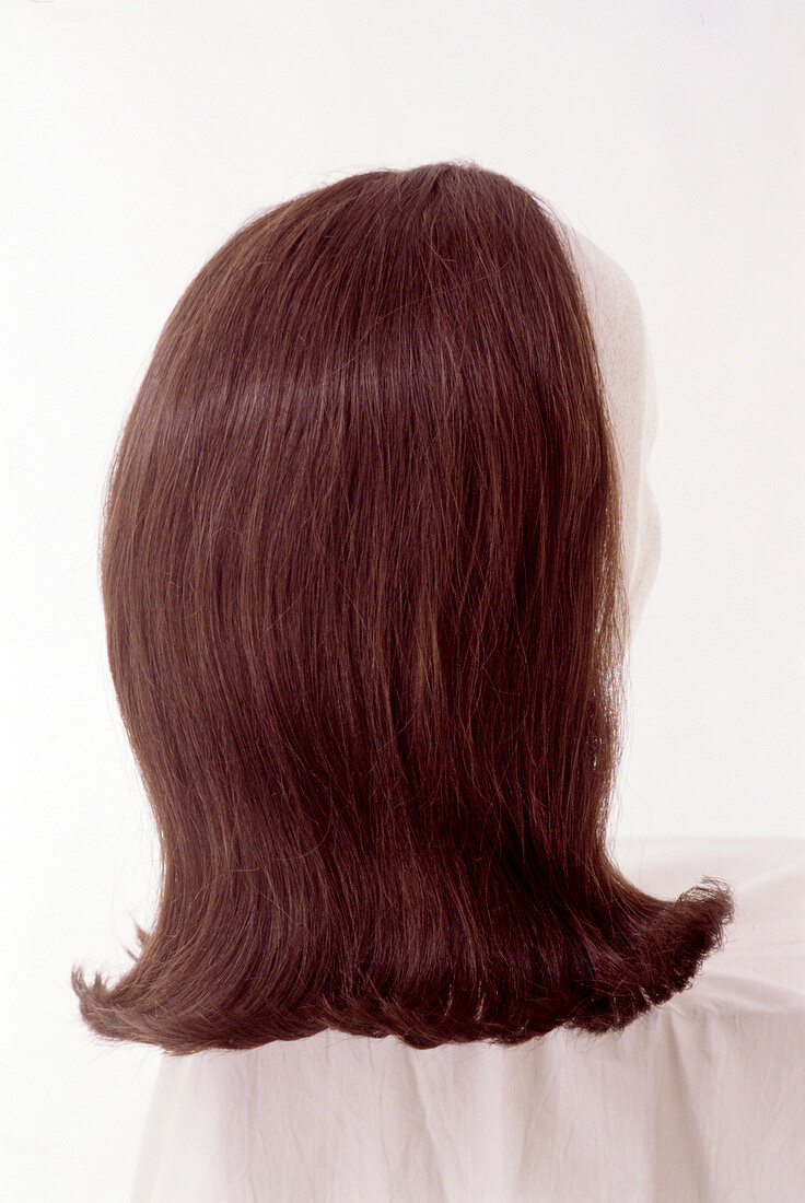 Artificial brunette hair with outer roller