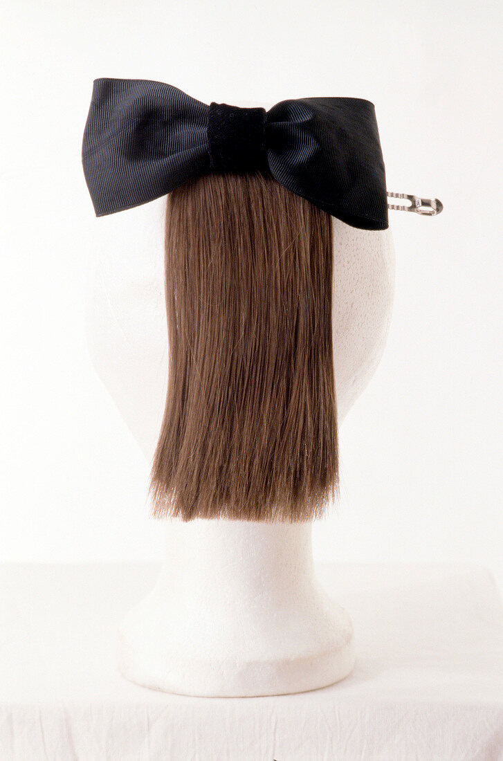 Artificial ponytail with black hair bow
