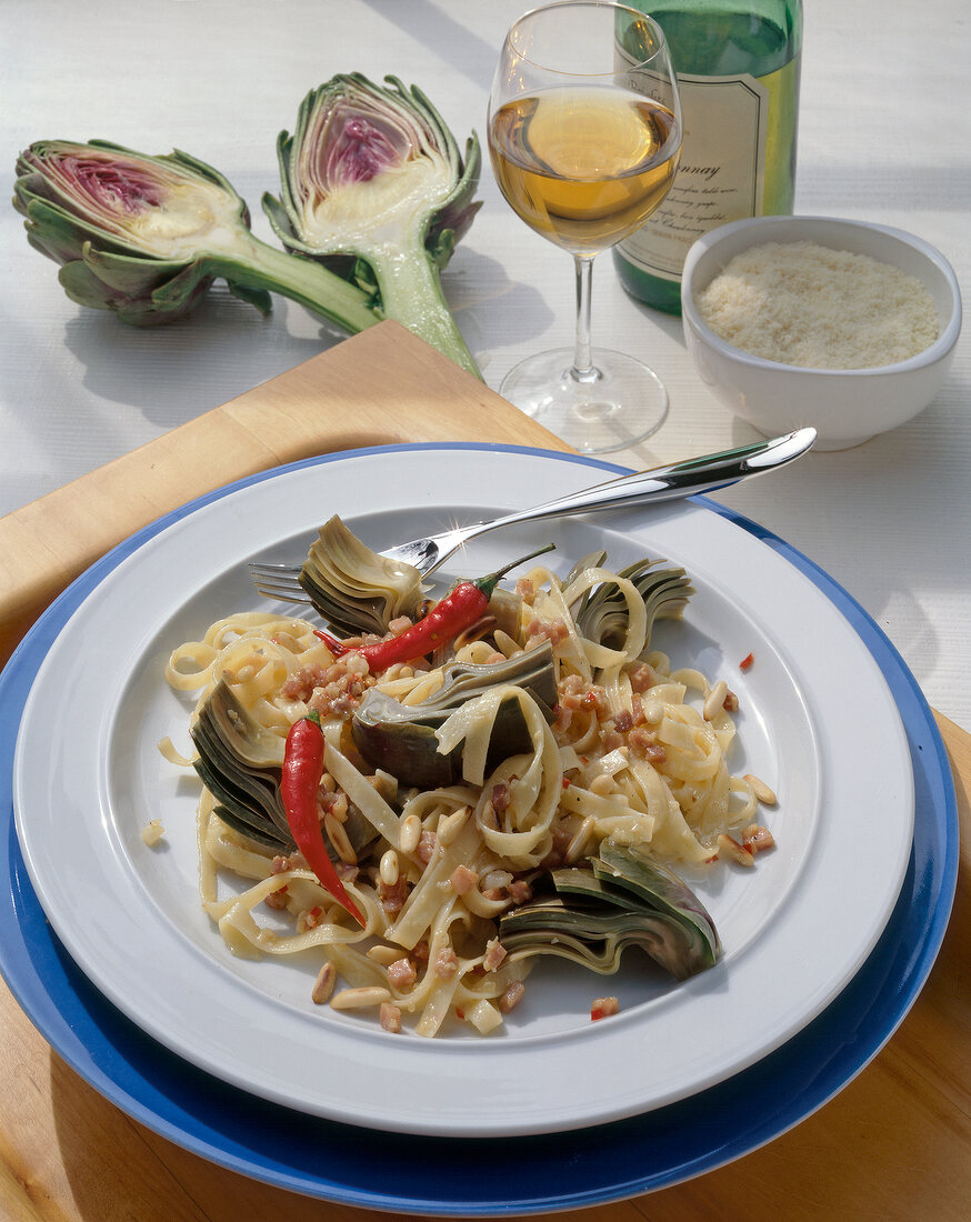 Fettuccine with artichokes on plate