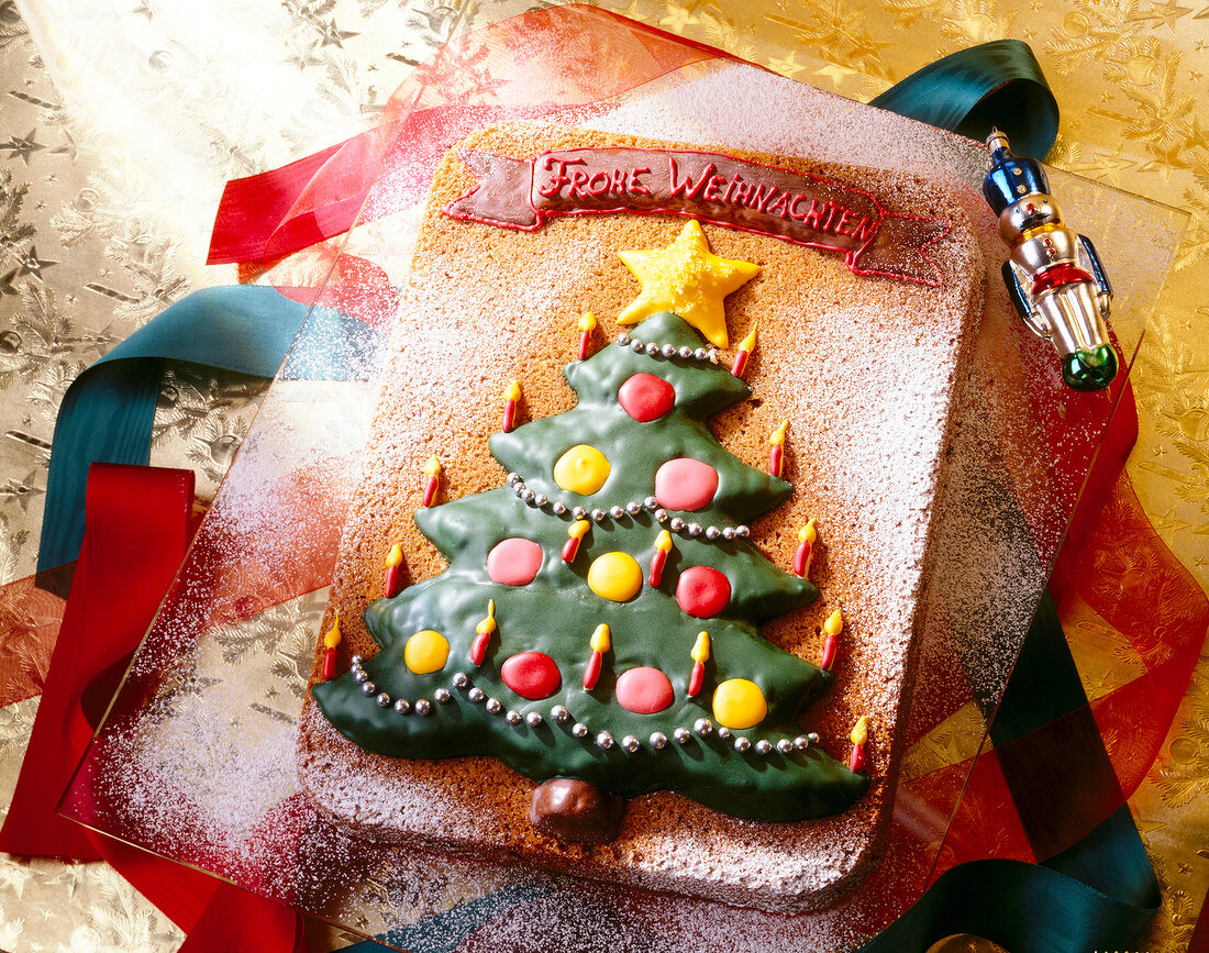 Rectangular chocolate cake with Christmas tree made of icing