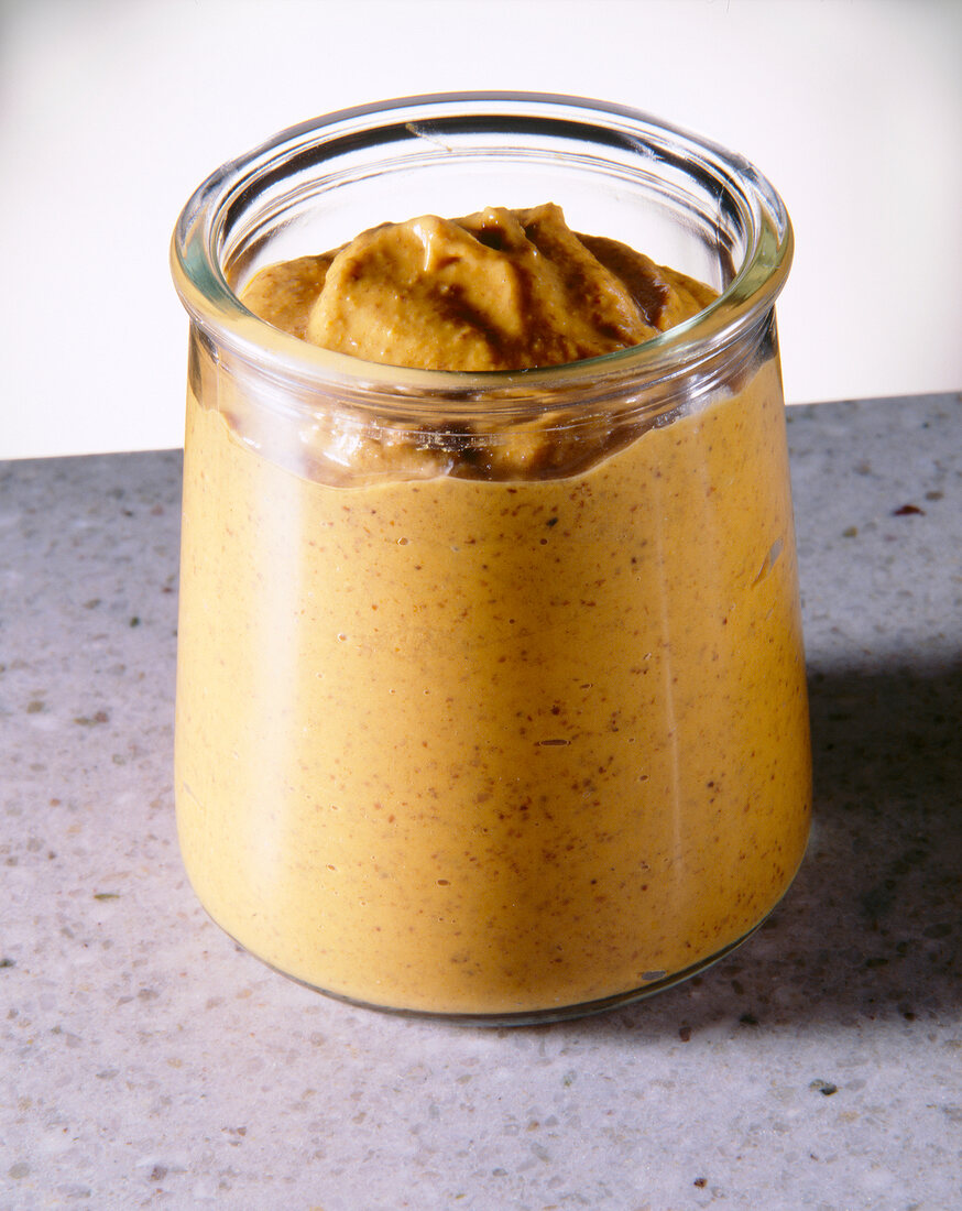 Close-up of barbecue and mustard sauce in glass jar