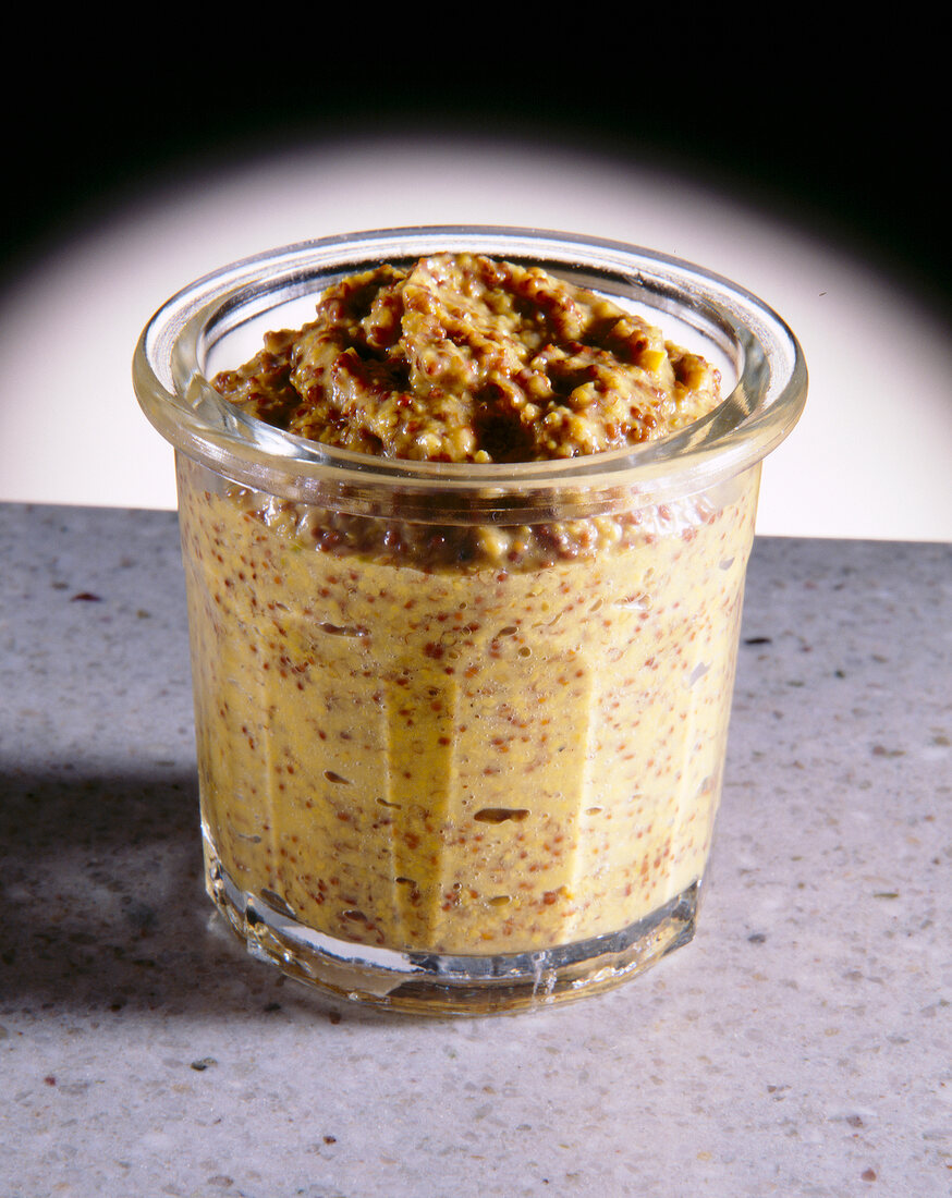 Close-up of yellow Rotisseur mustard in glass container