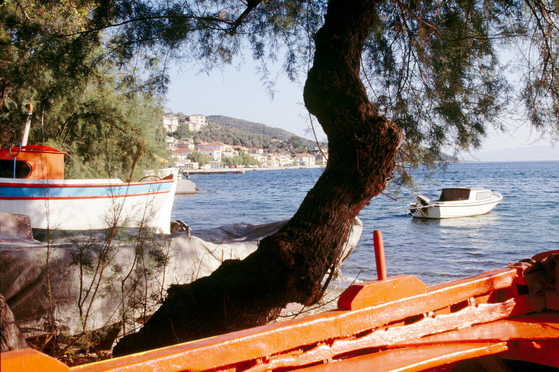 View of fishing boat overlooking village of Afissos in Pelion Peninsula, Greece