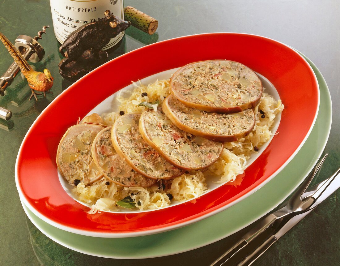 Bacon and potatoes with sauerkraut in serving dish