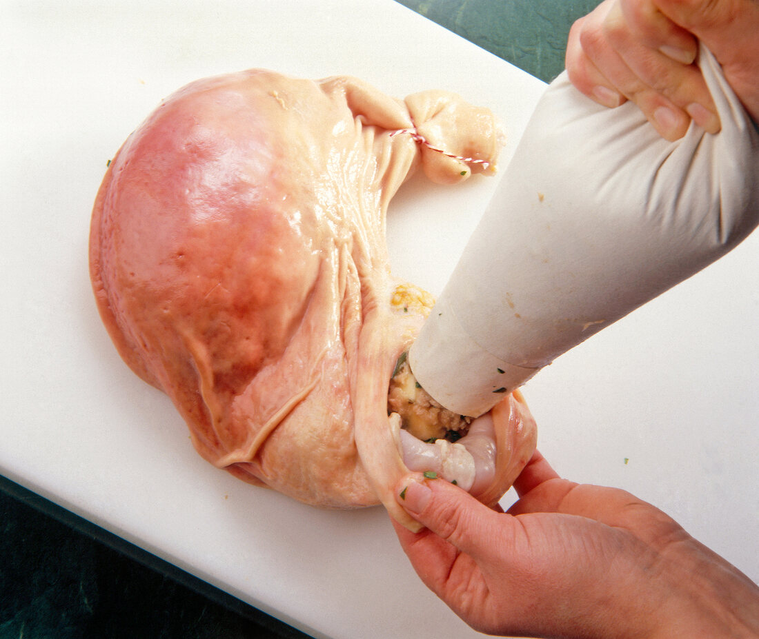 Pig stomach filled using piping bag