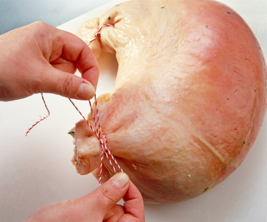 Stuffed pig's stomach tied with kitchen string