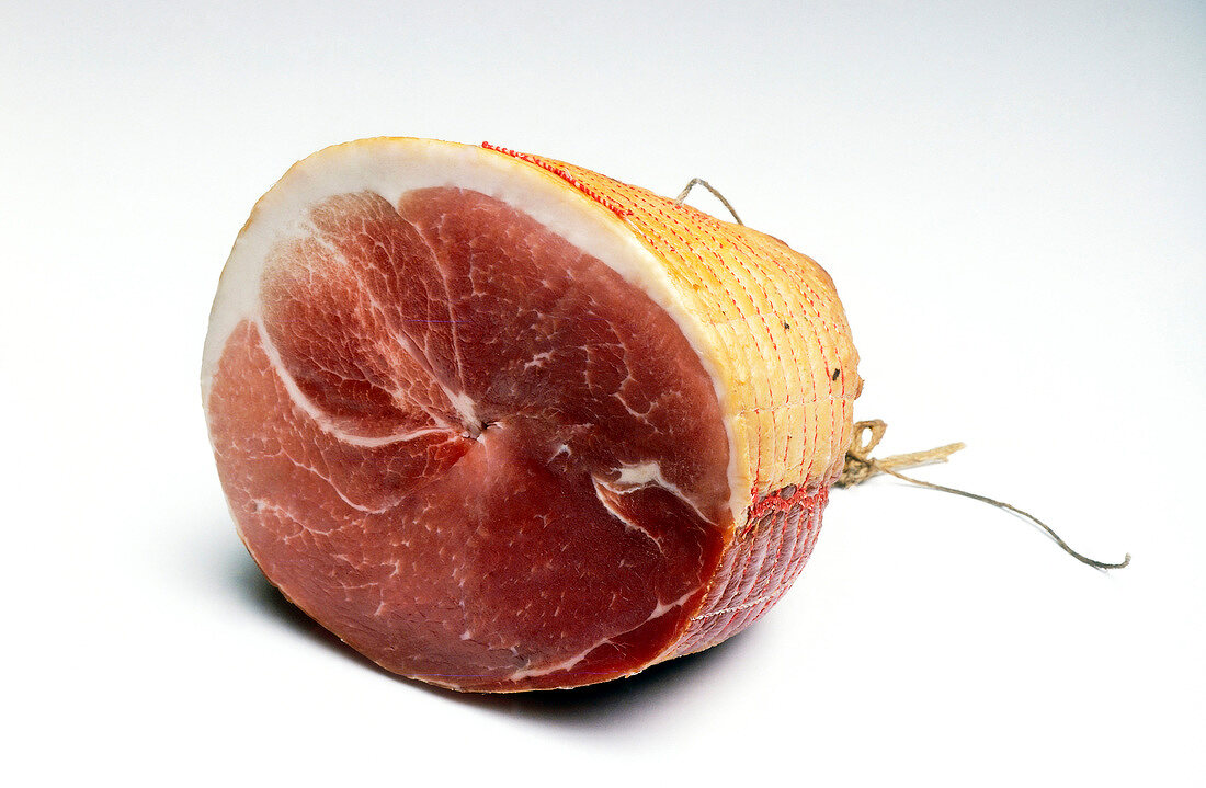 Close-up of rolled ham on white background