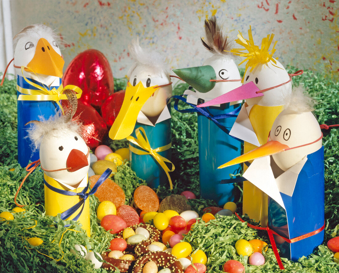 Handmade birds with false nose and Easter eggs
