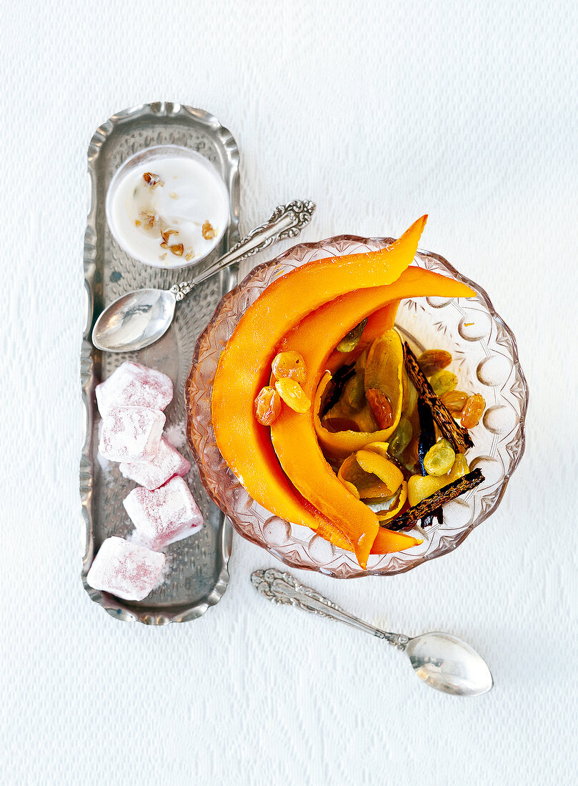 Kabak tatlisi of sweet pumpkin in a bowl, overhead view