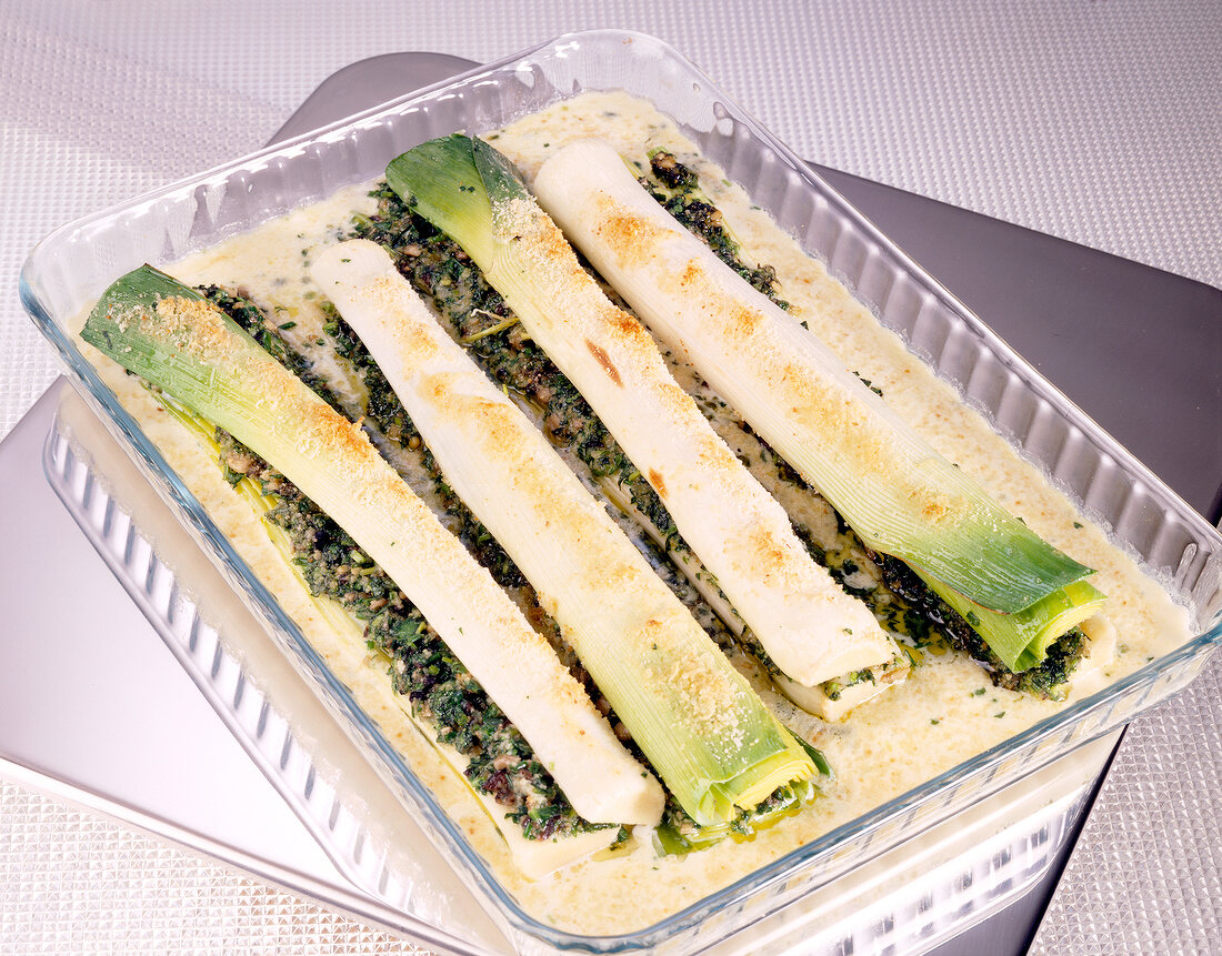 Leeks with herb stuffing in glass baking dish