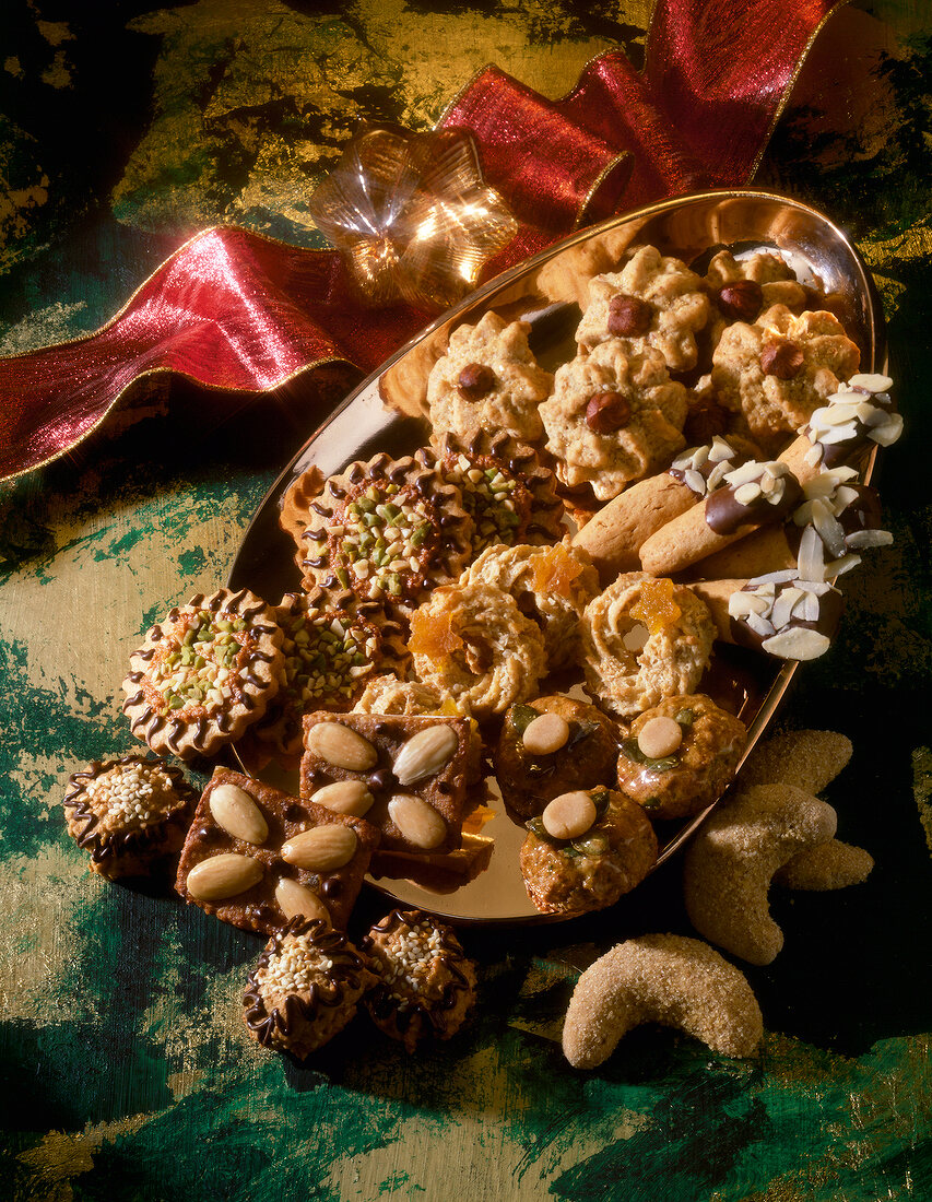 Various almond cookies on a plate for Christmas