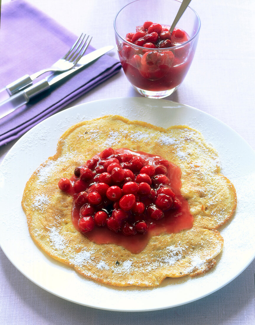 Walnut pancakes with cranberries on plate