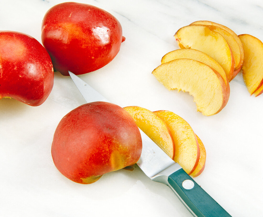 Close-up of halved and slices of nectarines