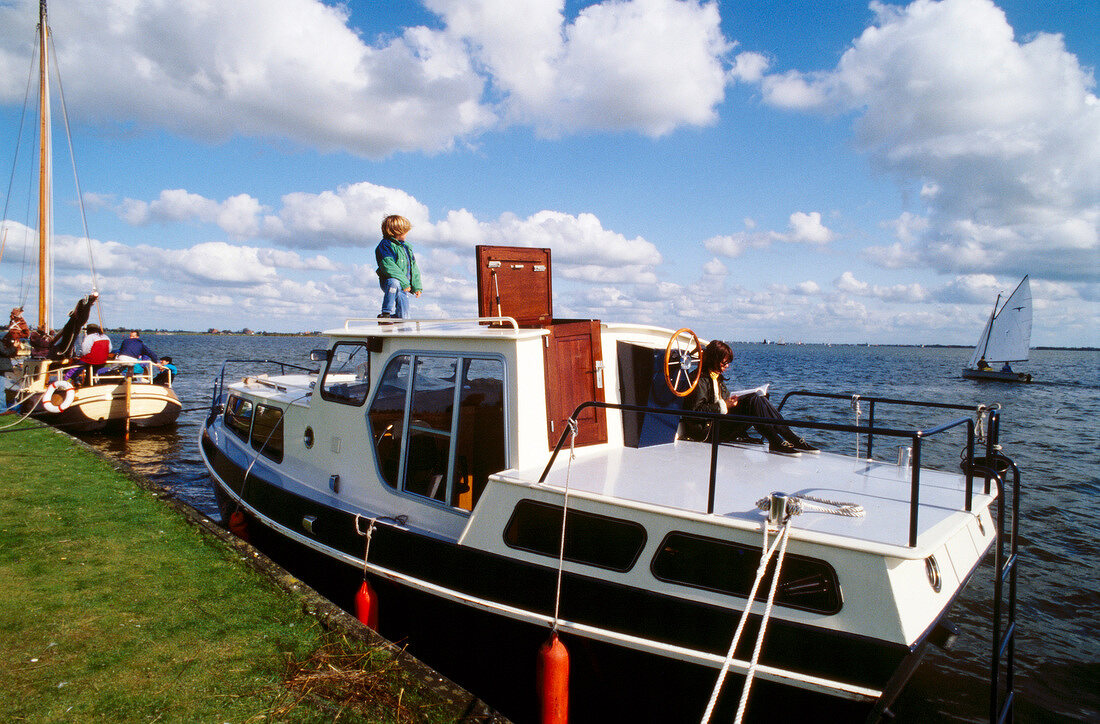 View of houseboat moored at sea side