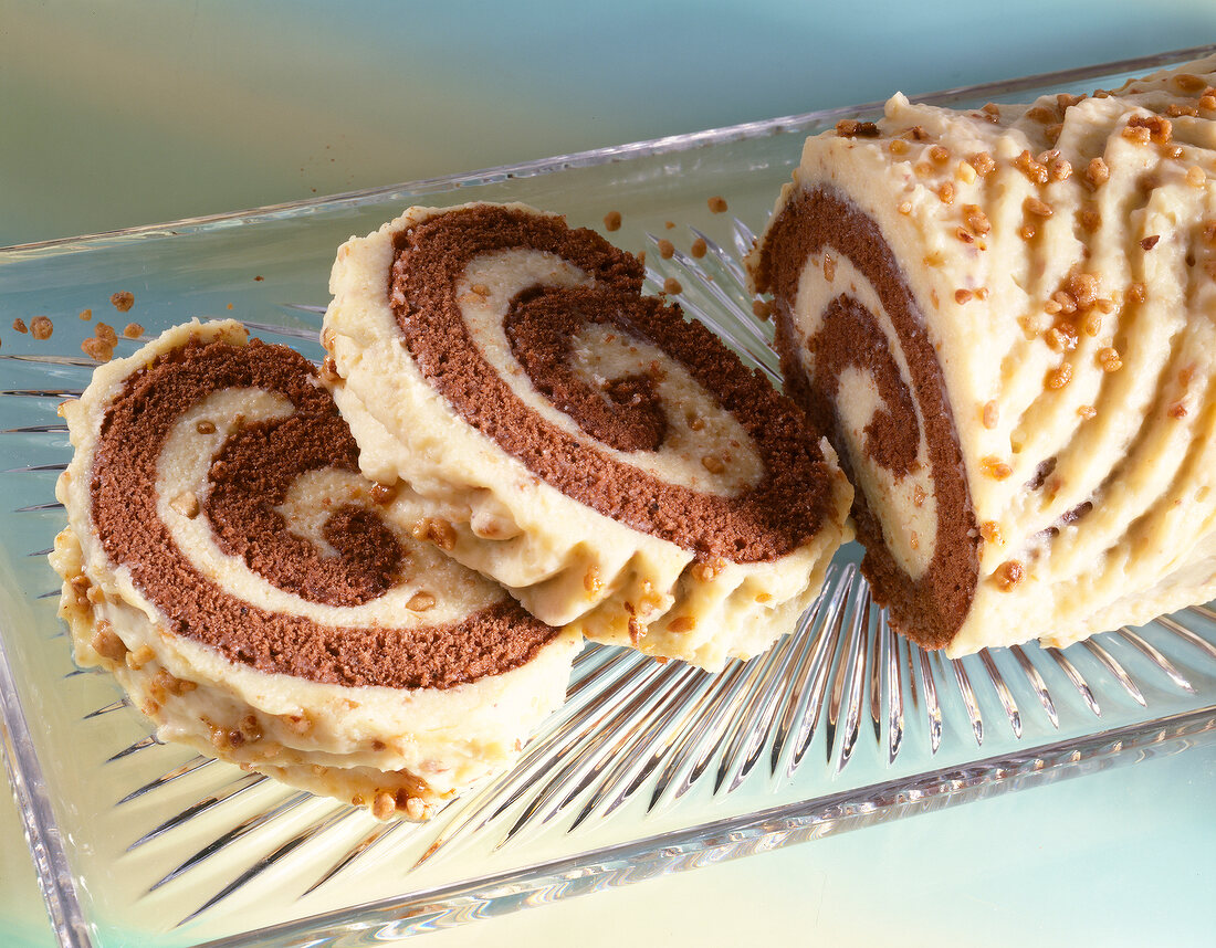 Close-up of two slices of Swiss roll with praline cream