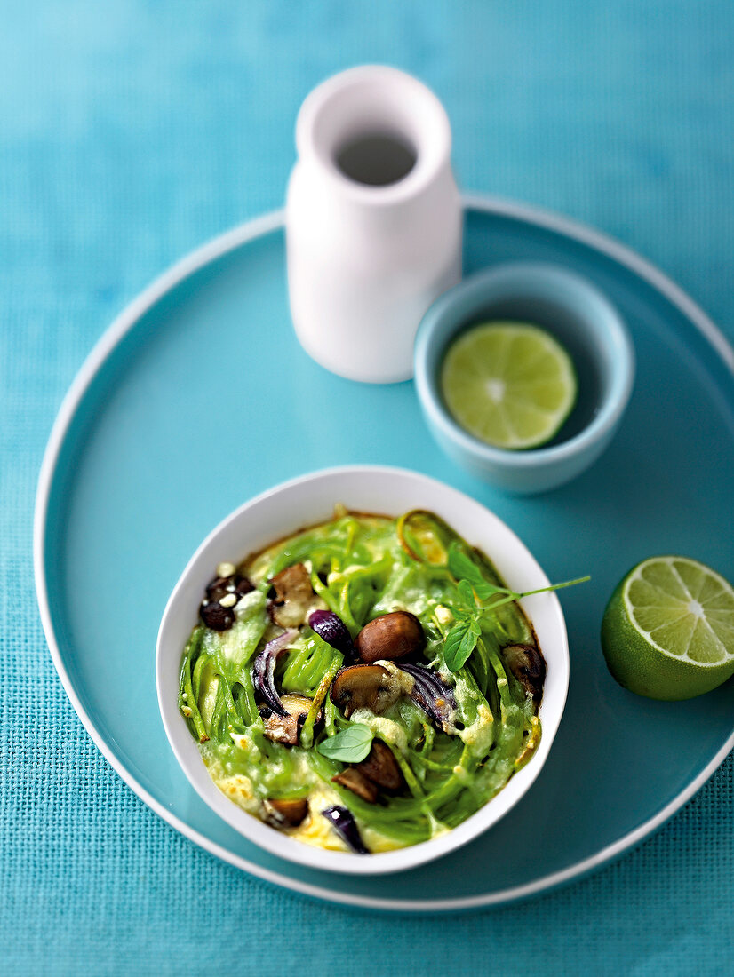 Baked green pasta in bowl