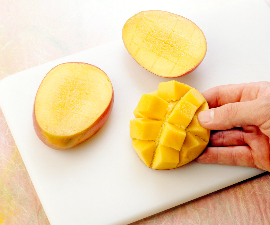 Mango cut into cubes to prepare fruit sauce