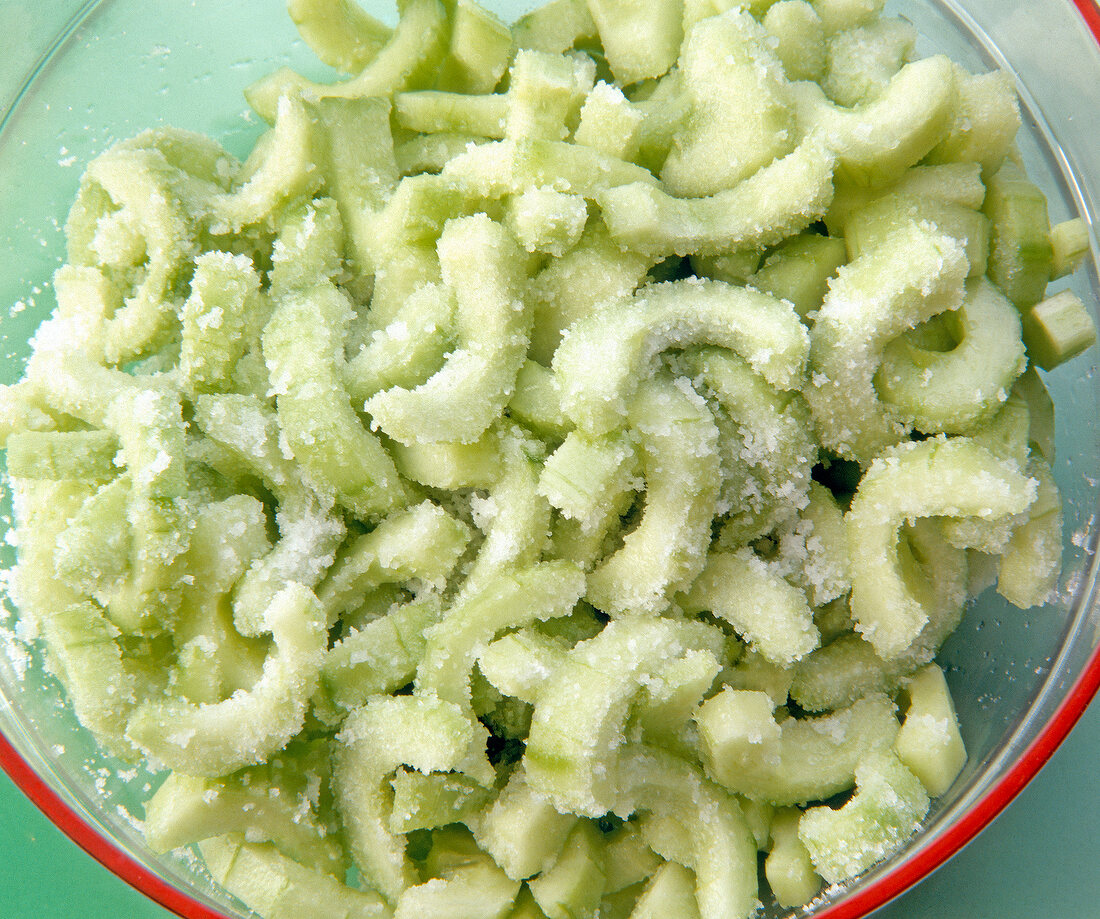 Close-up of salted cucumber slices in bowl