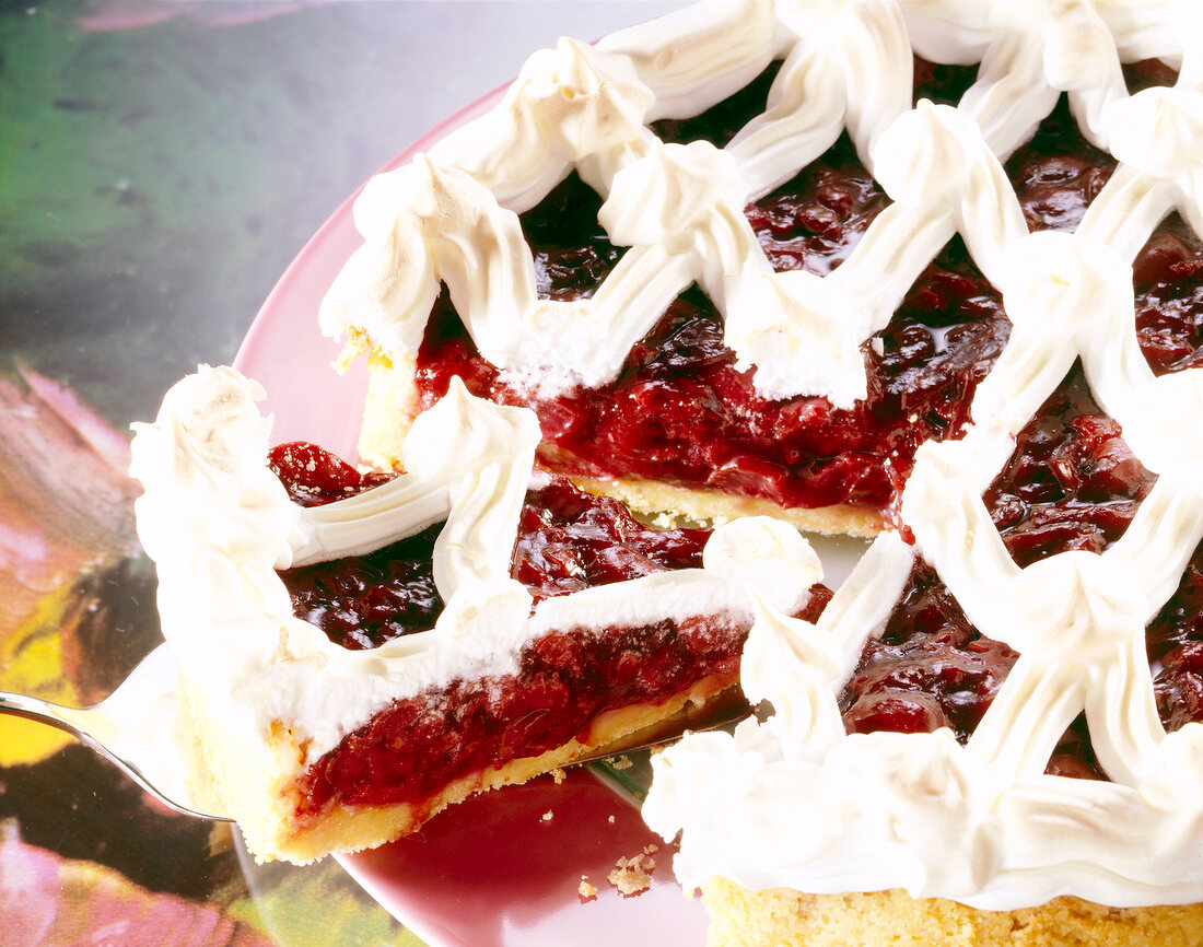 Close-up of cherry meringue pie with short crust pastry