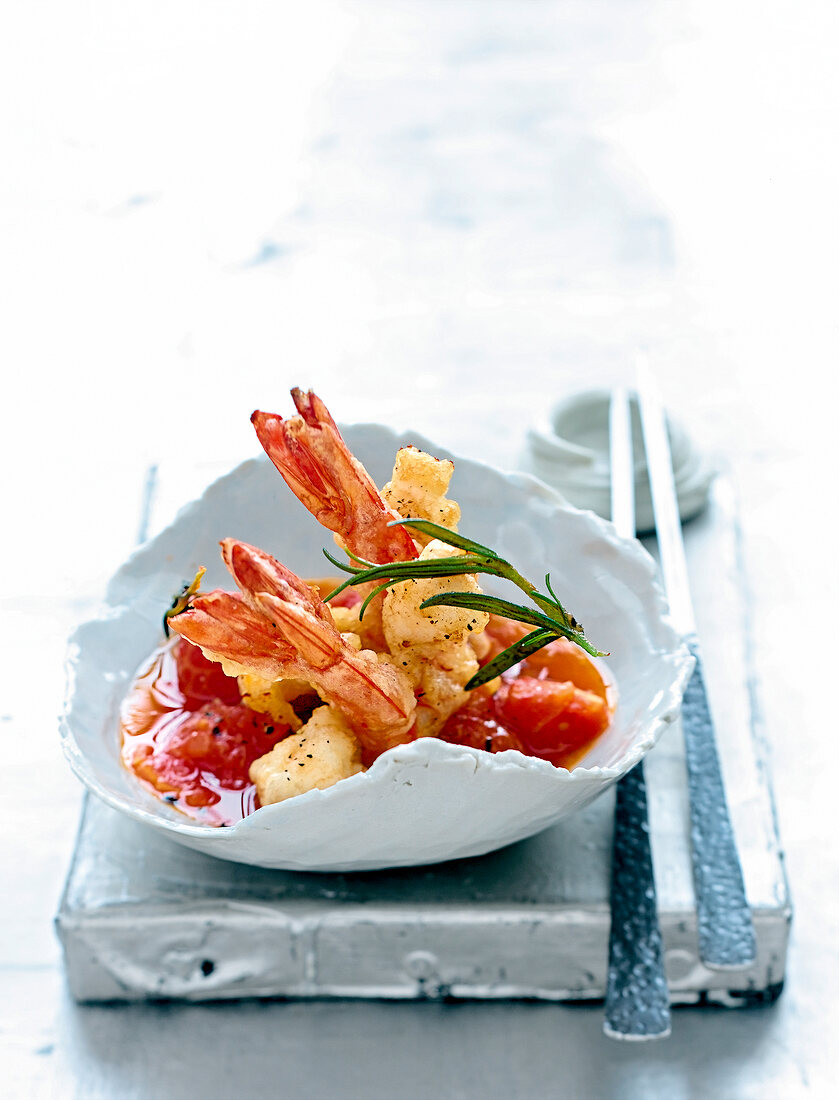 Black tiger prawns with tomato confit on plate