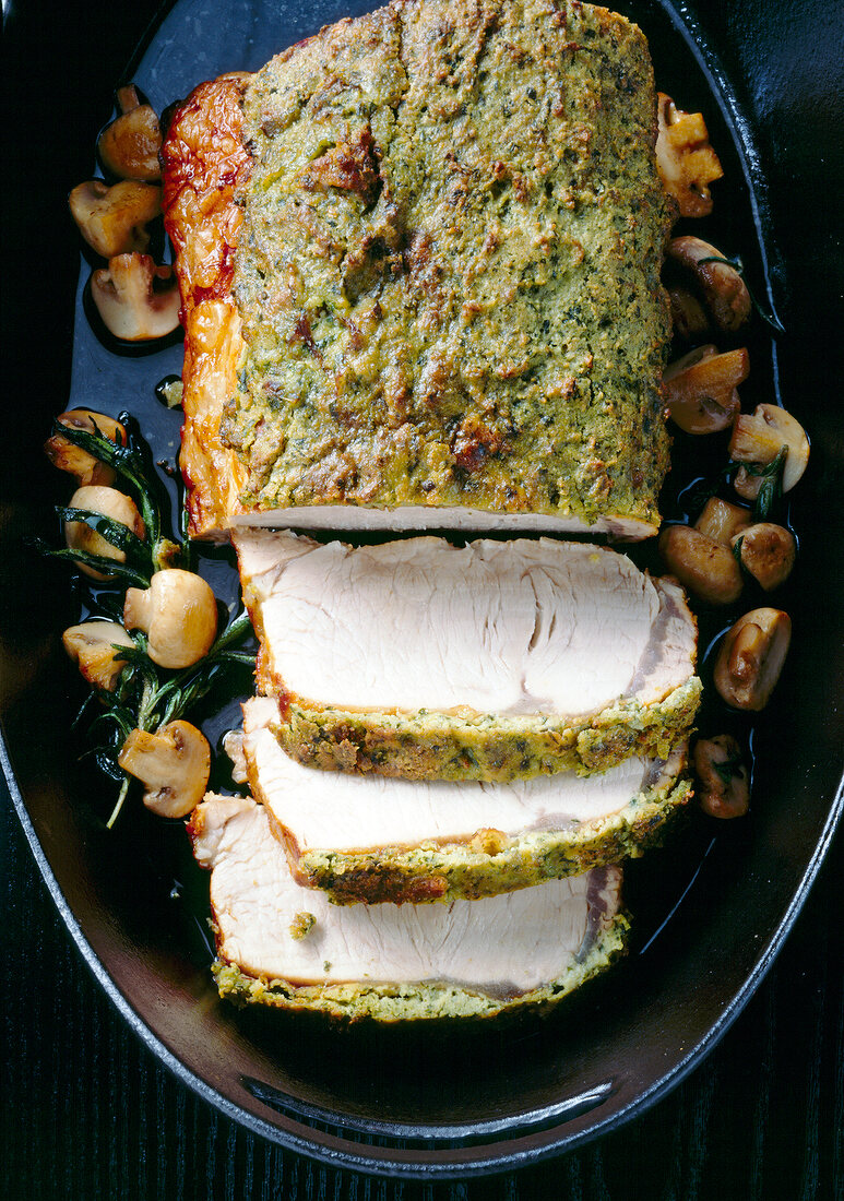 Veal with cheese and herb marinade cut in slices, overhead view