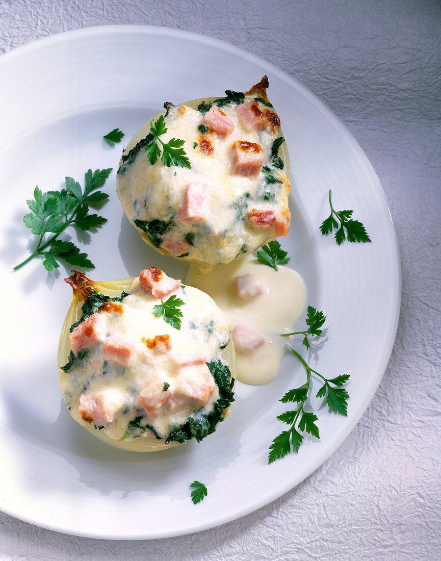Stuffed onions with parsley on plate