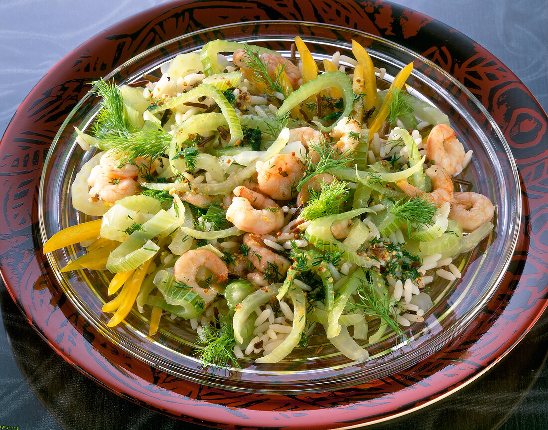 Fennel salad with wild rice, shrimp and dill on plate