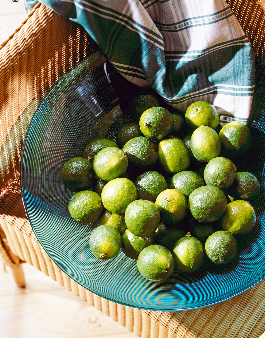 Green limes in large bowl