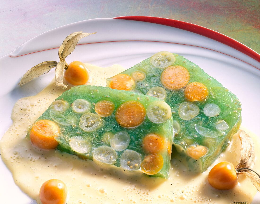 Gooseberry jelly with green gooseberries and physalis in dish