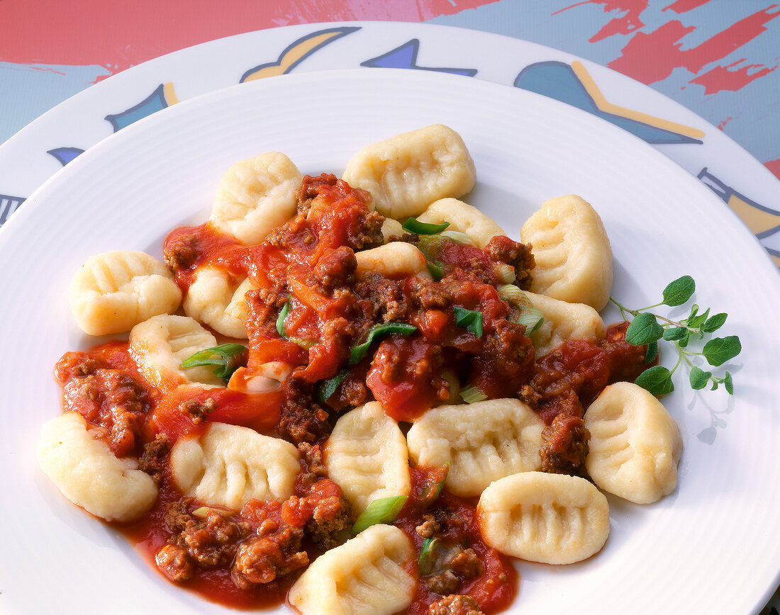 Gnocchi with mince and tomato sauce on plate